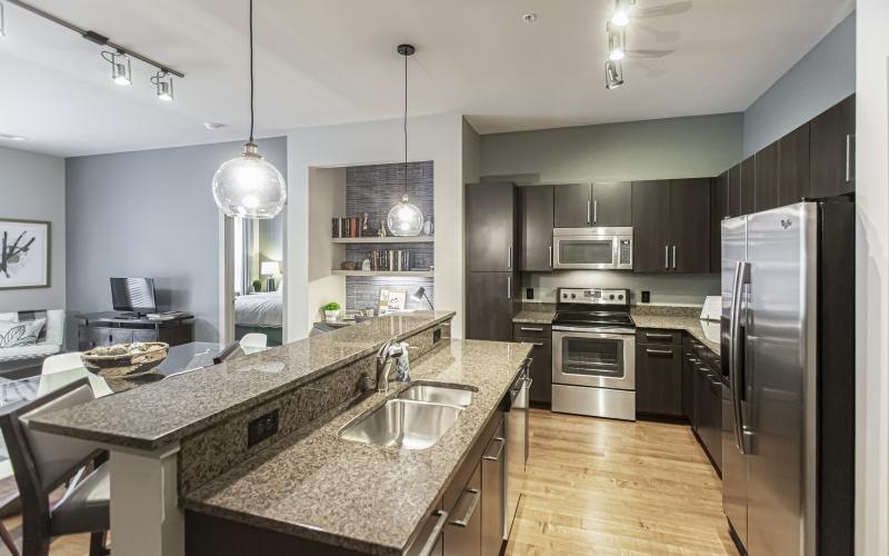 a kitchen with a marble island