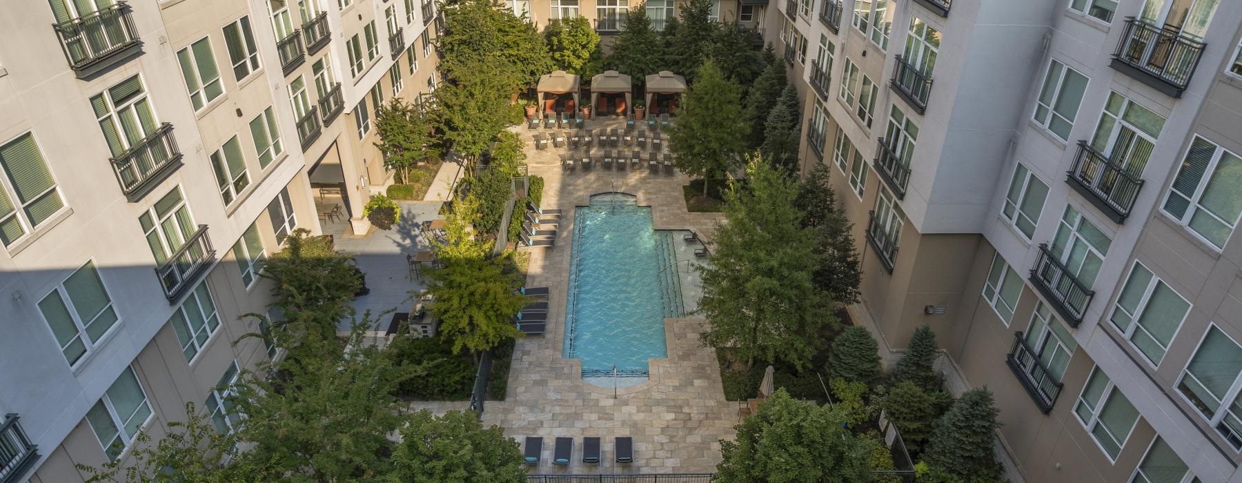 a pool surrounded by buildings