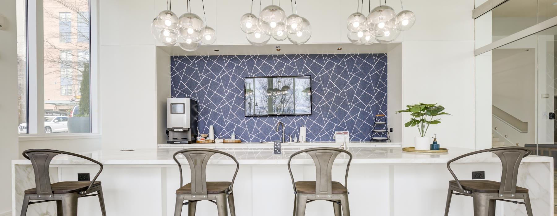 a kitchen with a blue wall